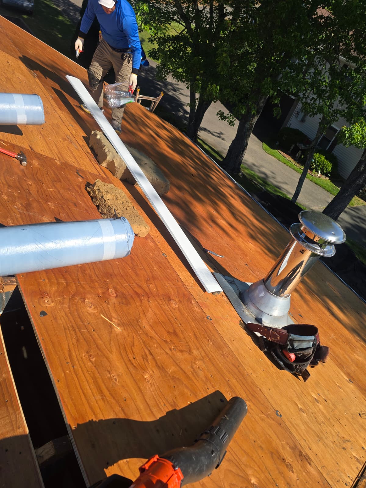 Pipe flashing and roof deck work
