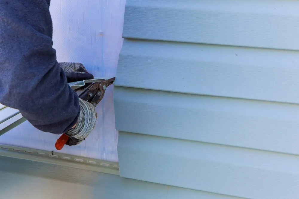 Vinyl siding installation in progress